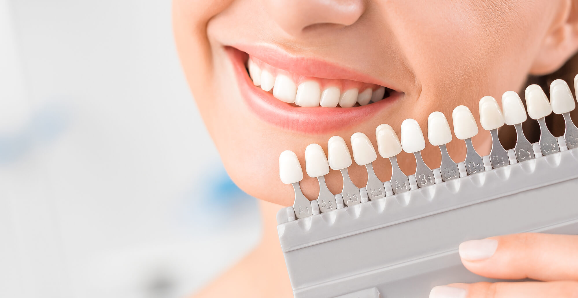 picture showing a girl holding dental implants in Port St. Lucie