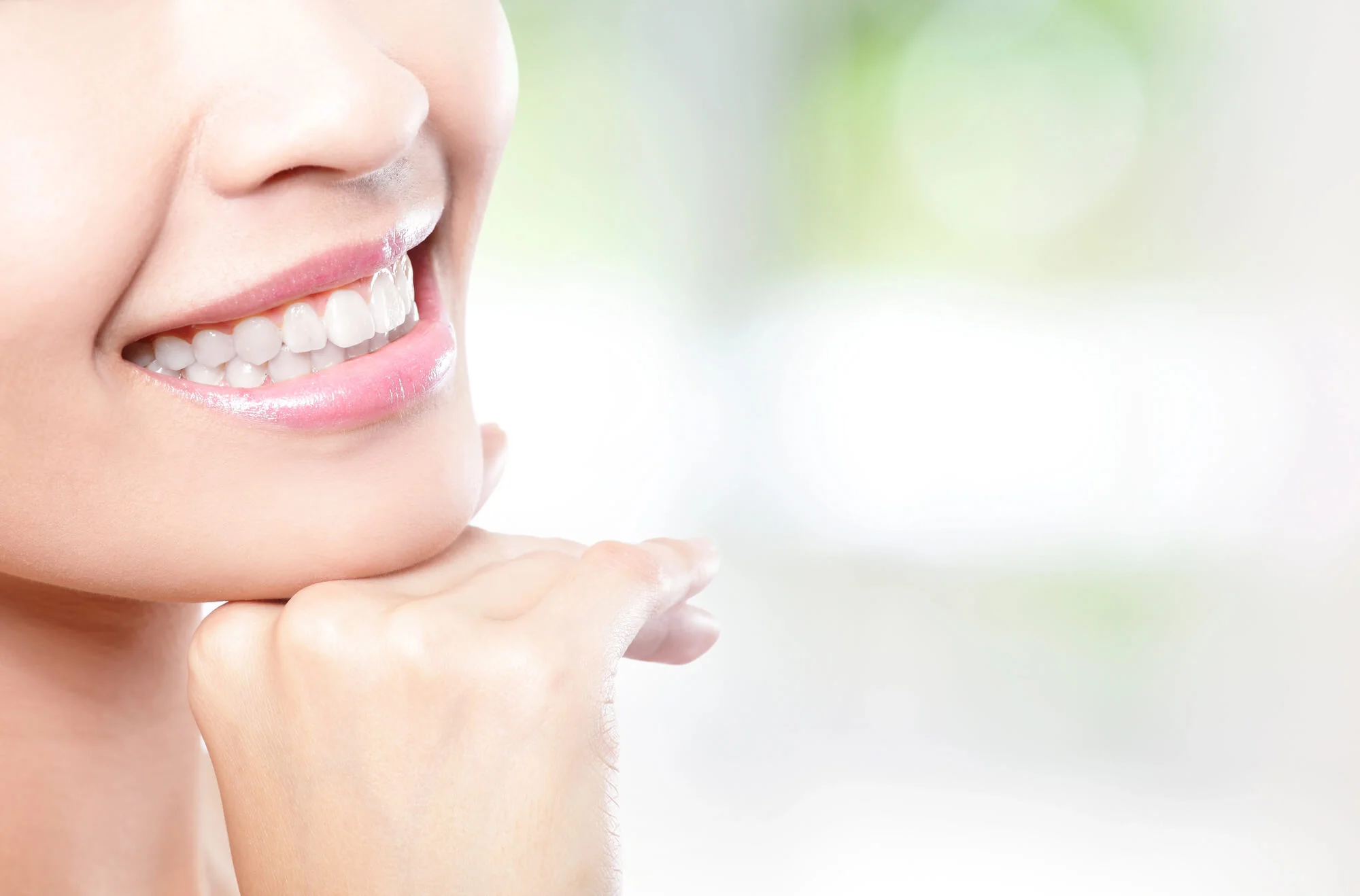 Woman smiling with bright white teeth, teeth whitening in Fort Pierce