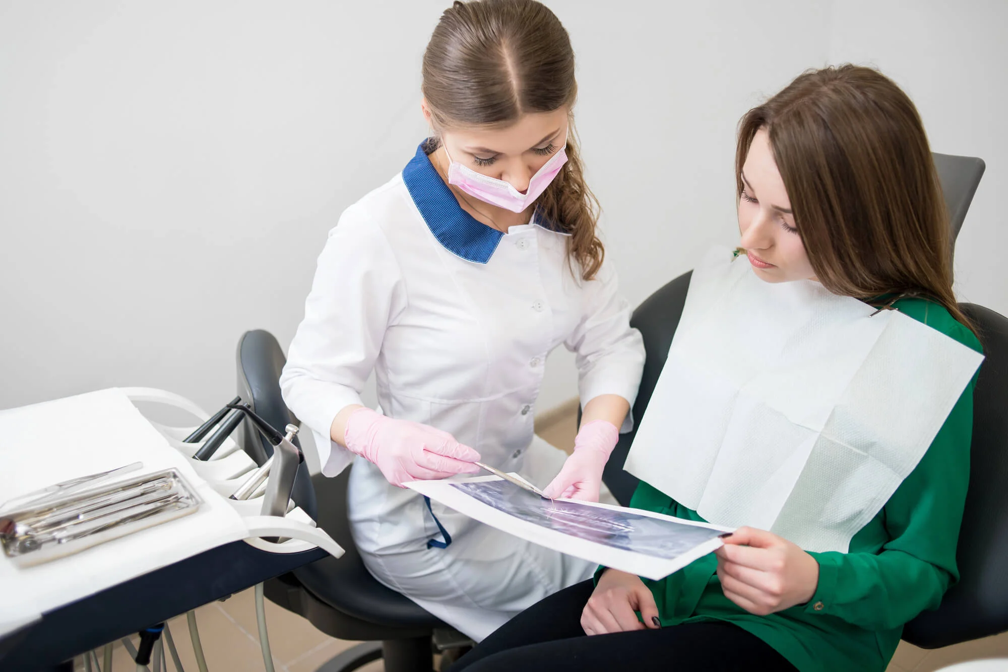 Dentist showing x-ray to patient emergency dentist in Fort Pierce