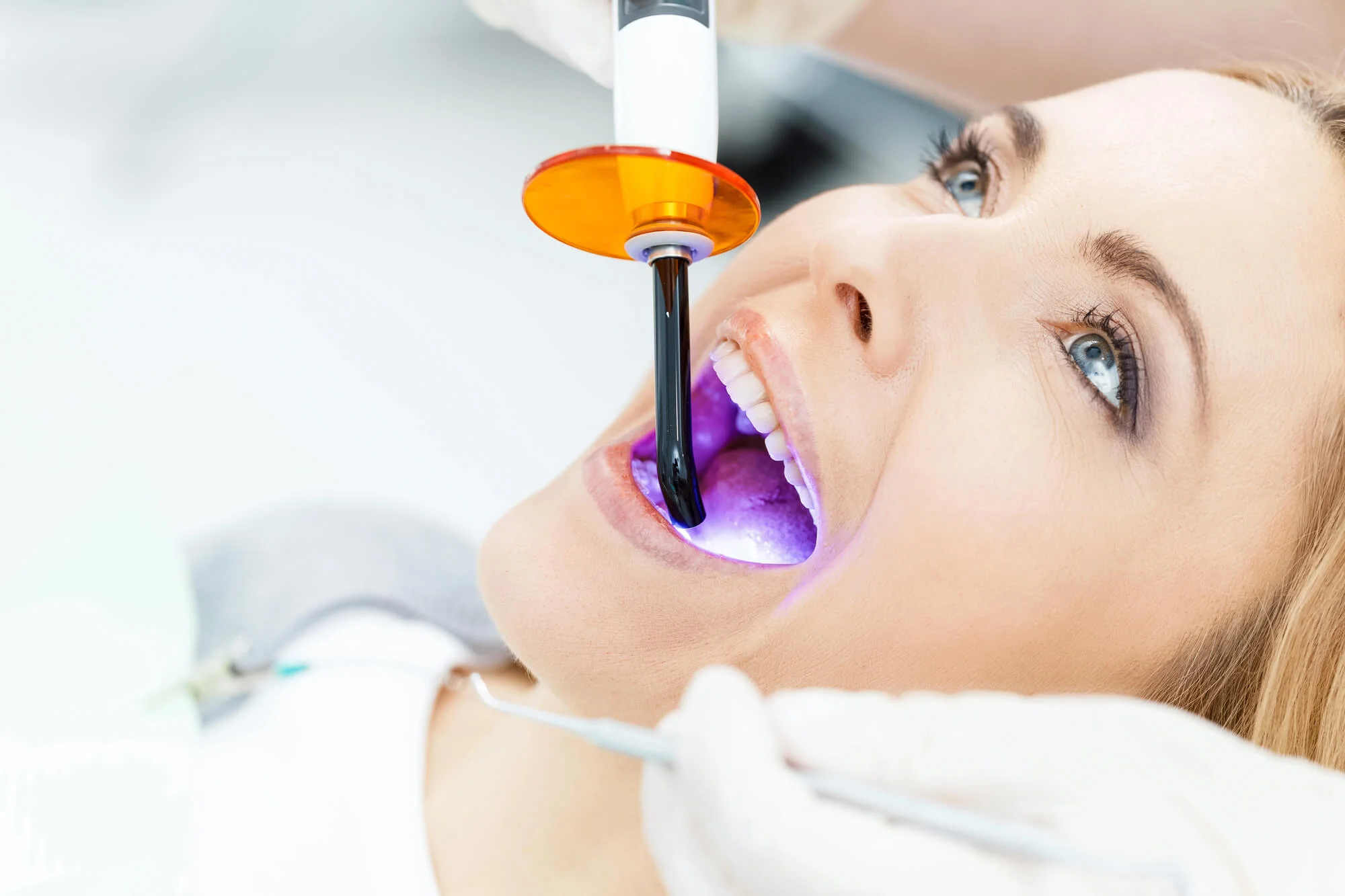 Patient teeth whitening light treatment cosmetic dentist in Fort Pierce