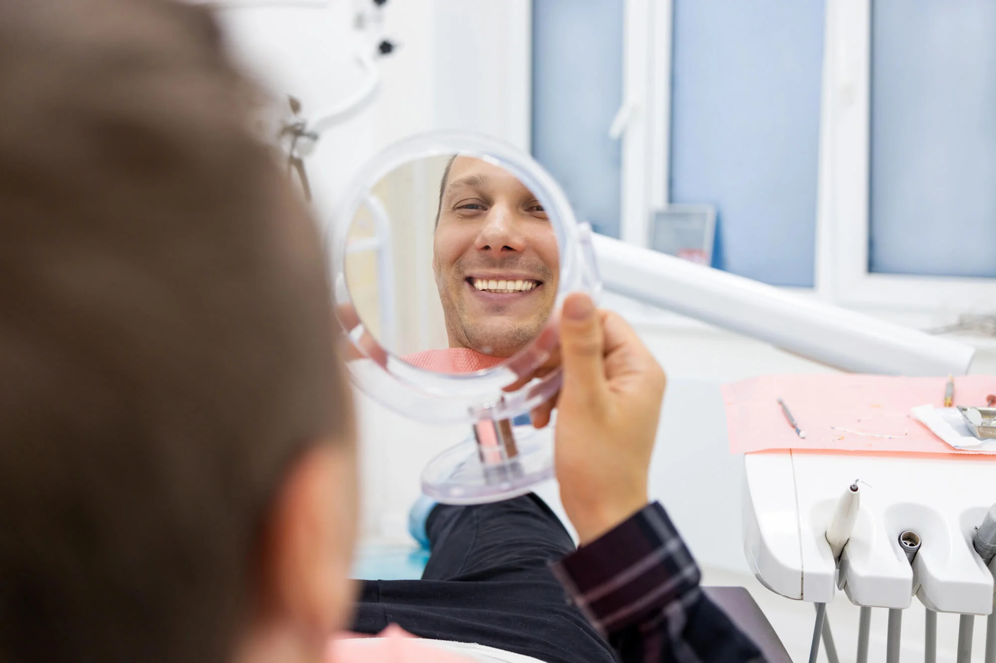 Patient smiling after implant treatment dental implants in Vero Beach