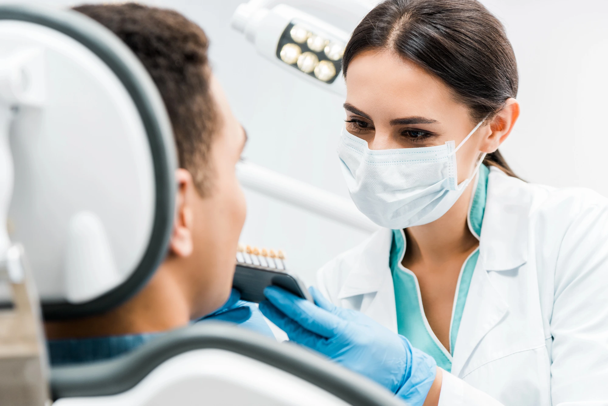 Man undergoing teeth whitening by Dentist Fort Pierce