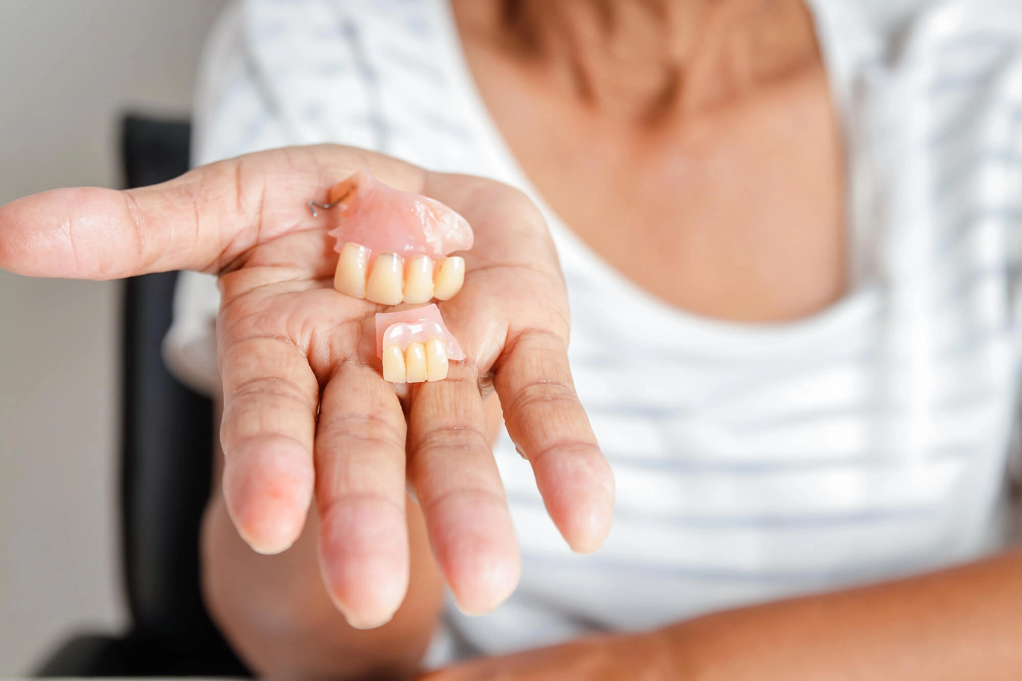 Girl-holding-Treasure-Coast-Dentures
