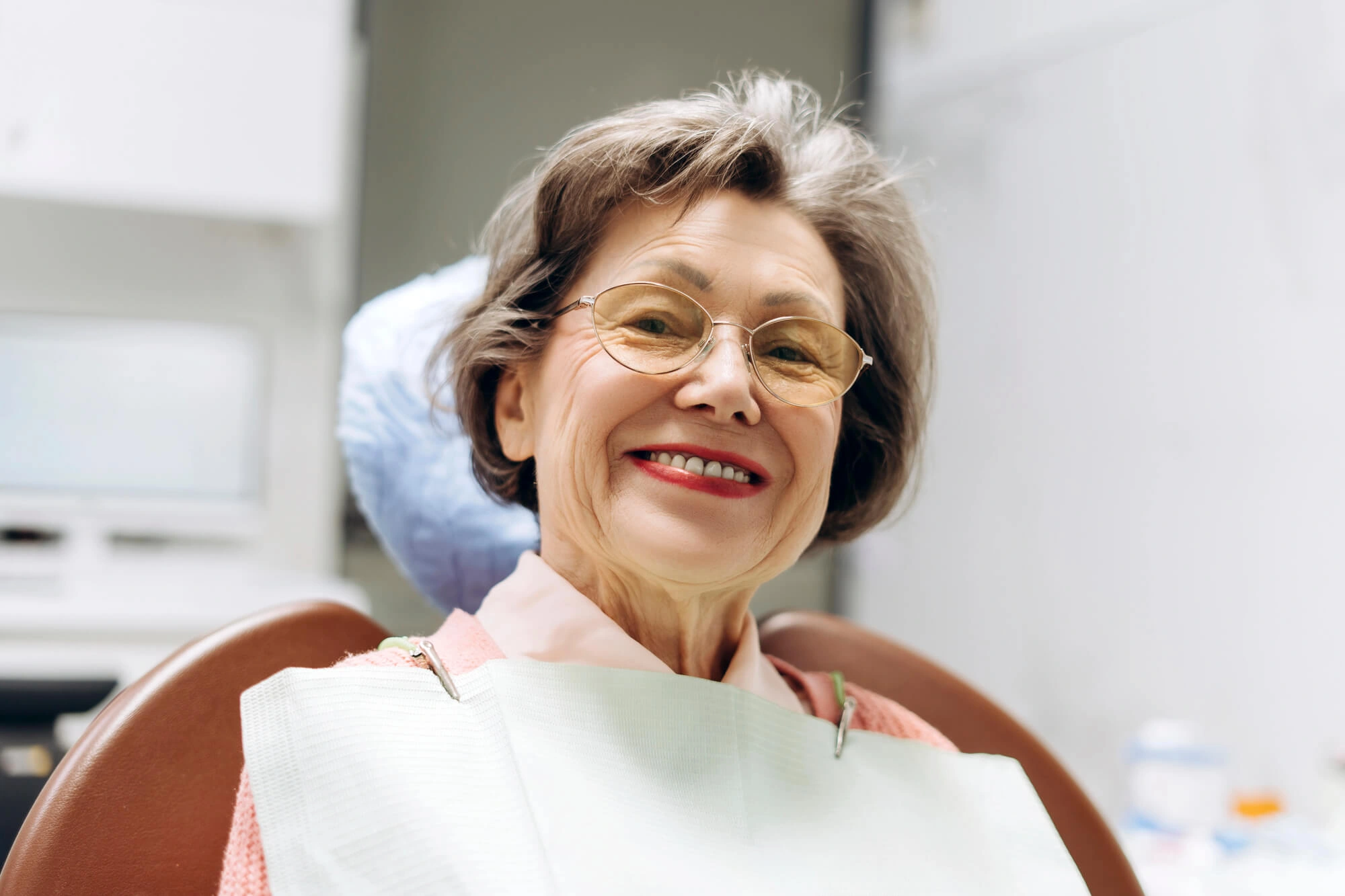 Woman-smiling-with-Treasure-Coast-Dentures