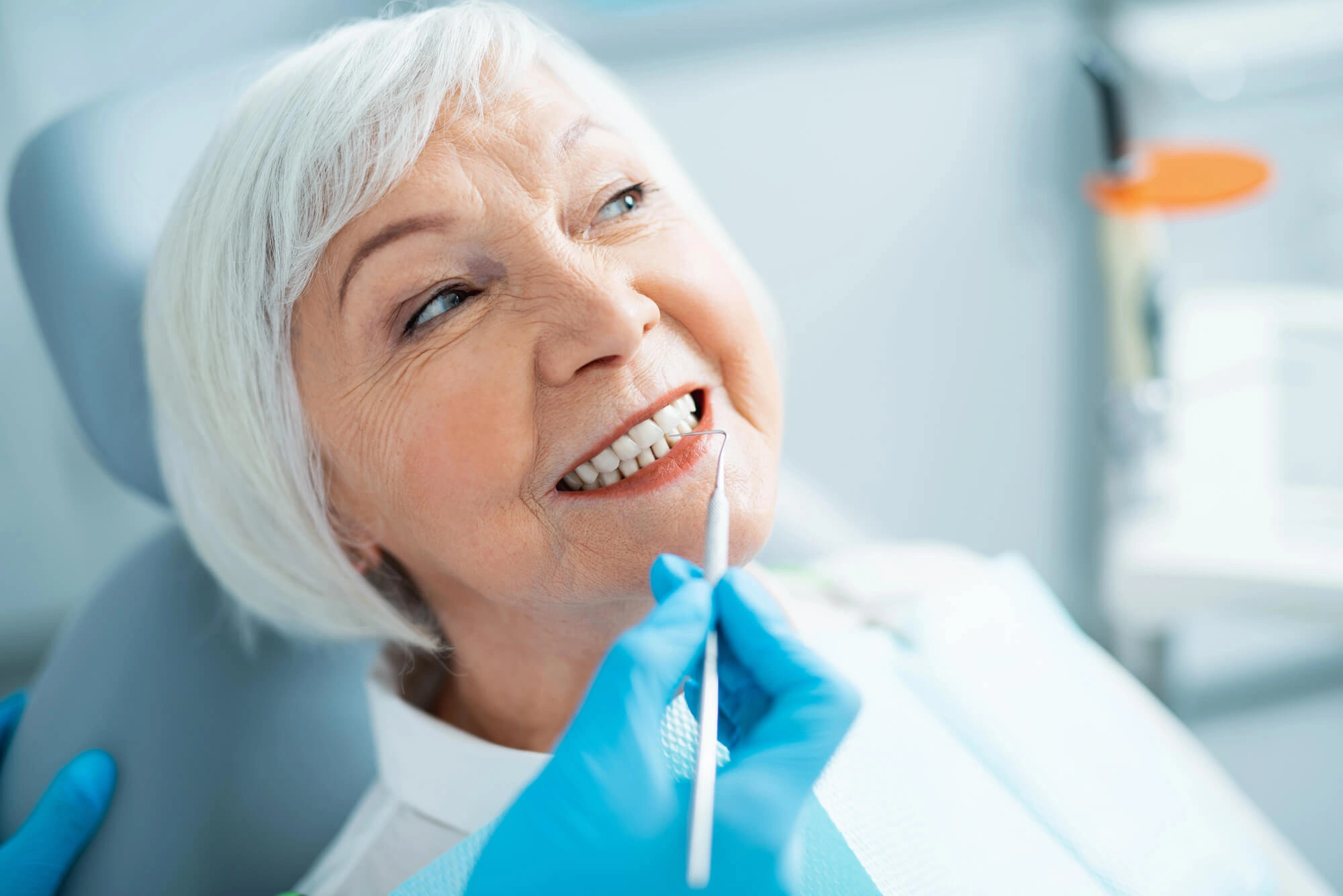 Senior-happy-with-her-Dental-Implants-Fort-Pierce