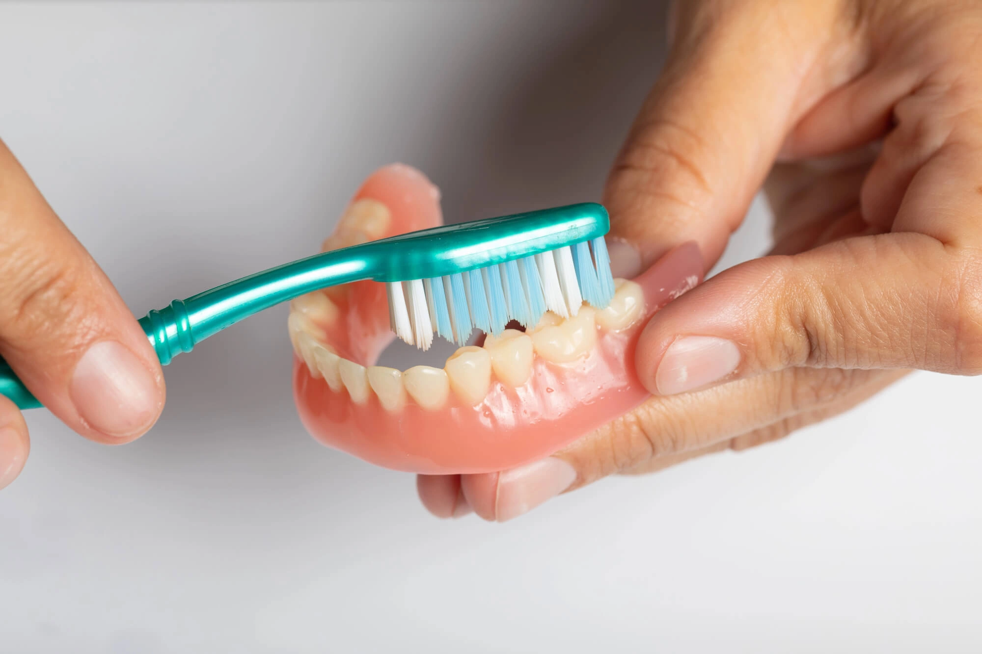 Brushing Fort Pierce Dentures