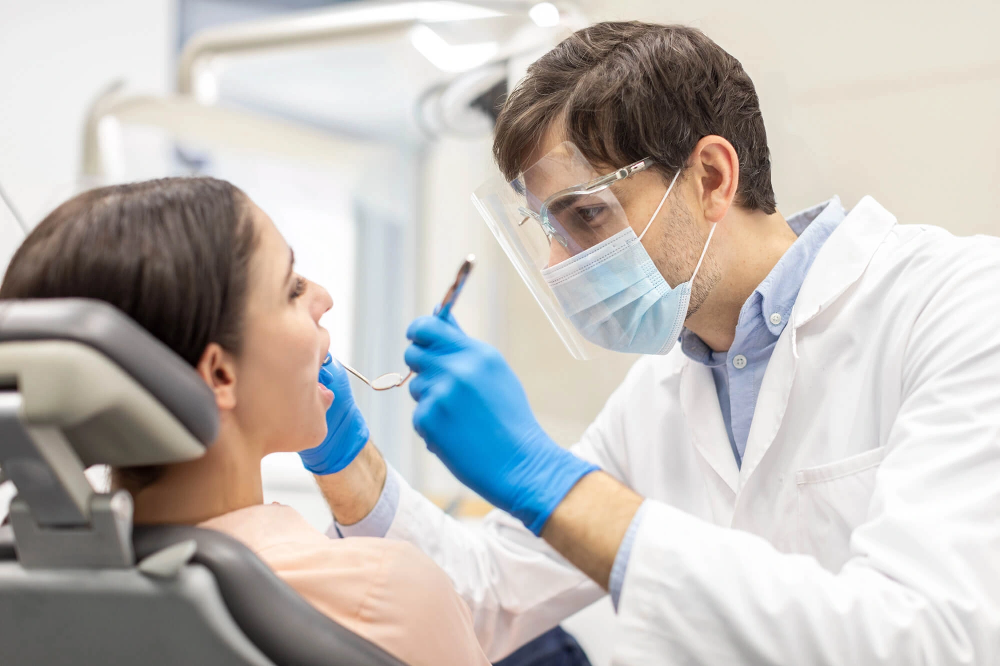 Fort Pierce Dentist checking womans teeth